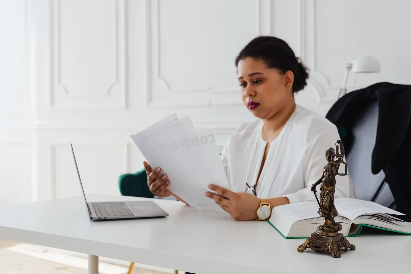 A professional reviewing a contract at a desk